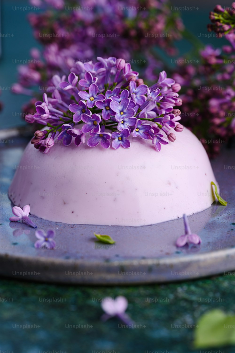 a cake with purple flowers on top of it