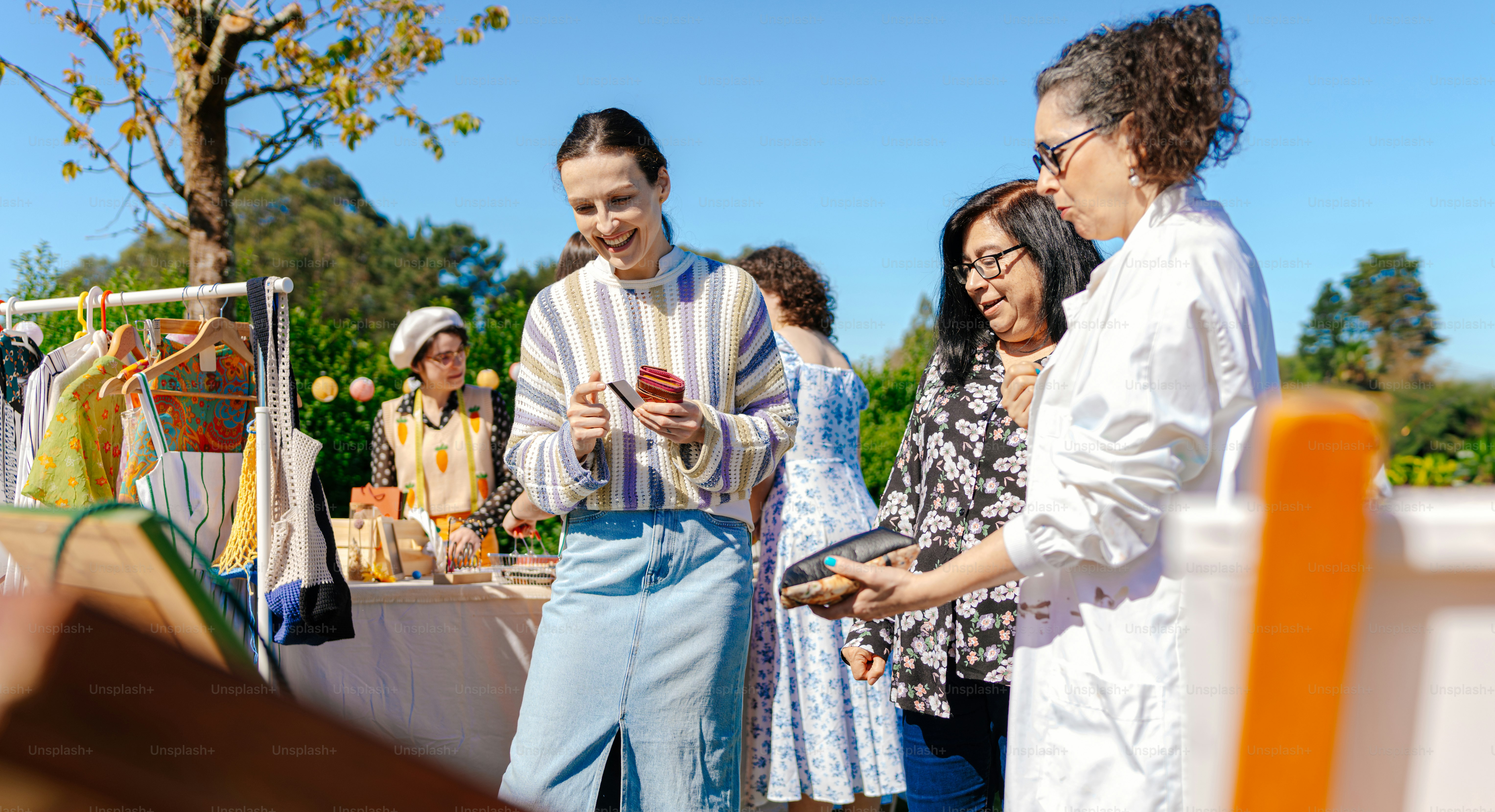 a group of people standing around a table