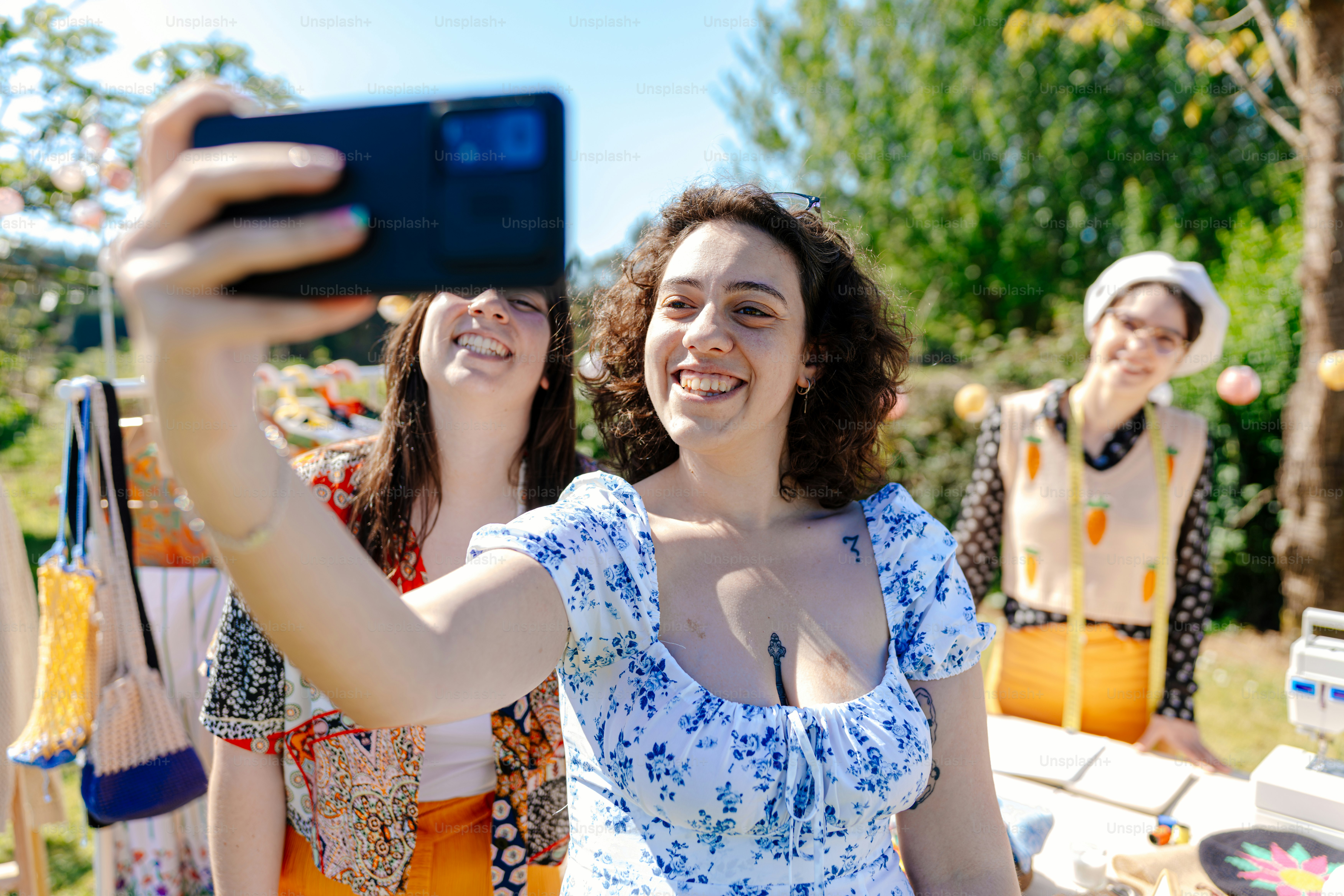a woman taking a picture with her cell phone
