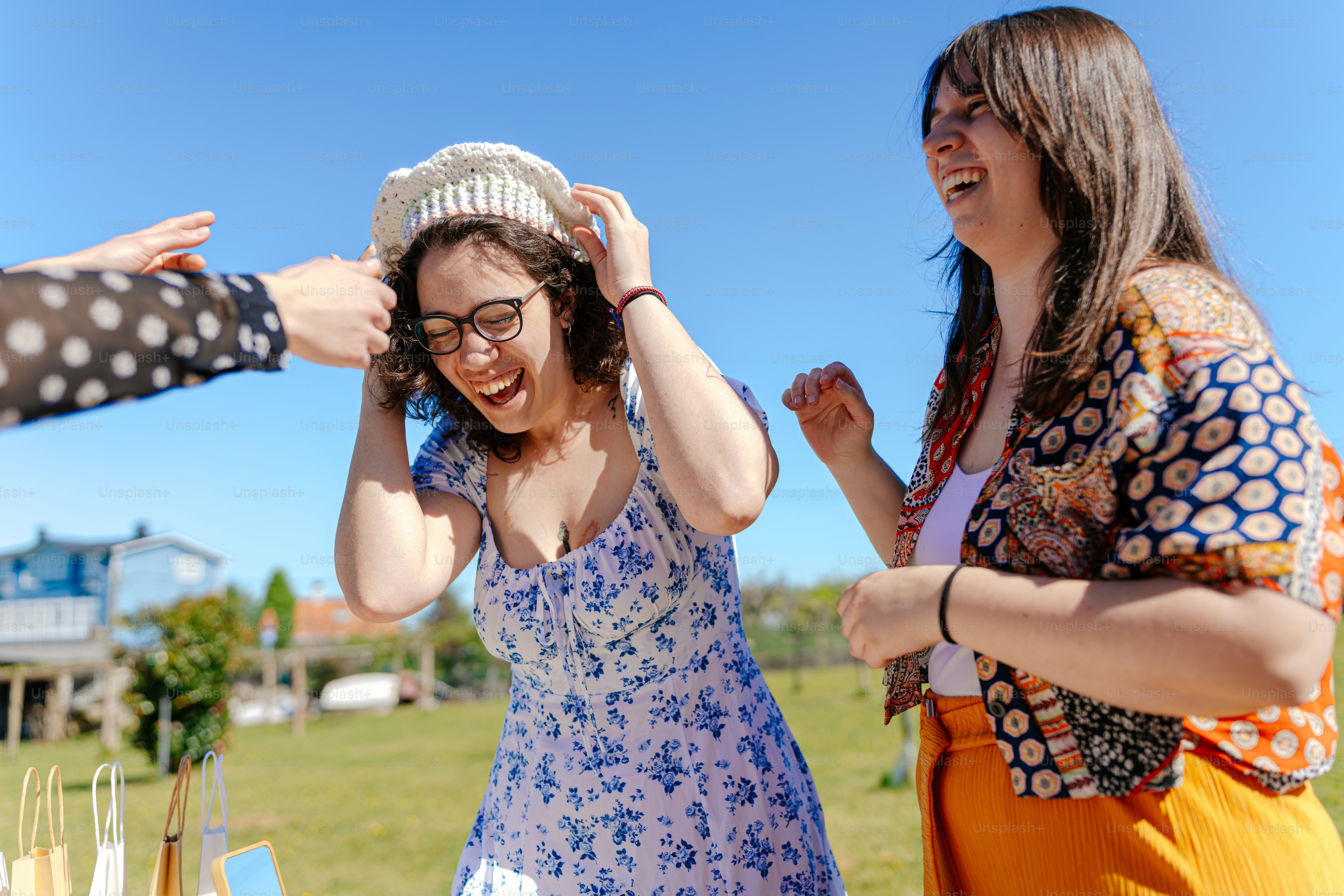 a group of women standing around each other