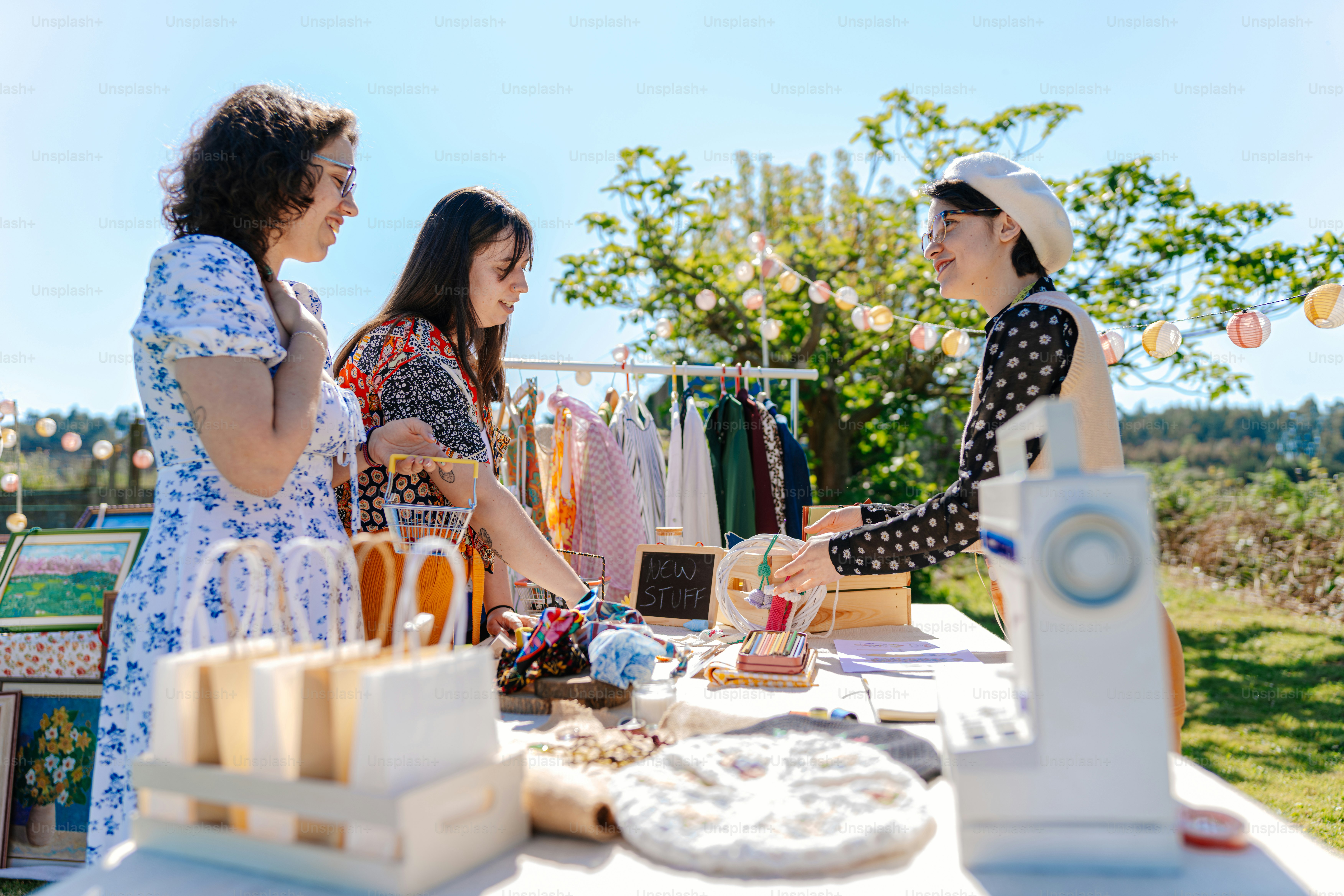 a group of women standing next to each other at a table