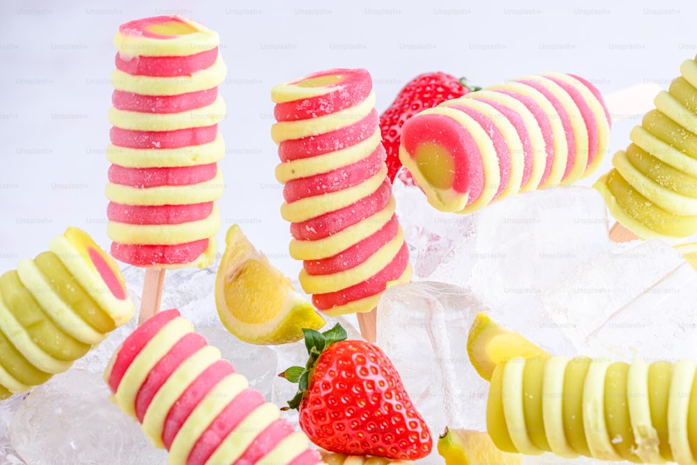 a group of fruit pops sitting on top of ice