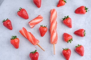 a bunch of strawberries are arranged on a table