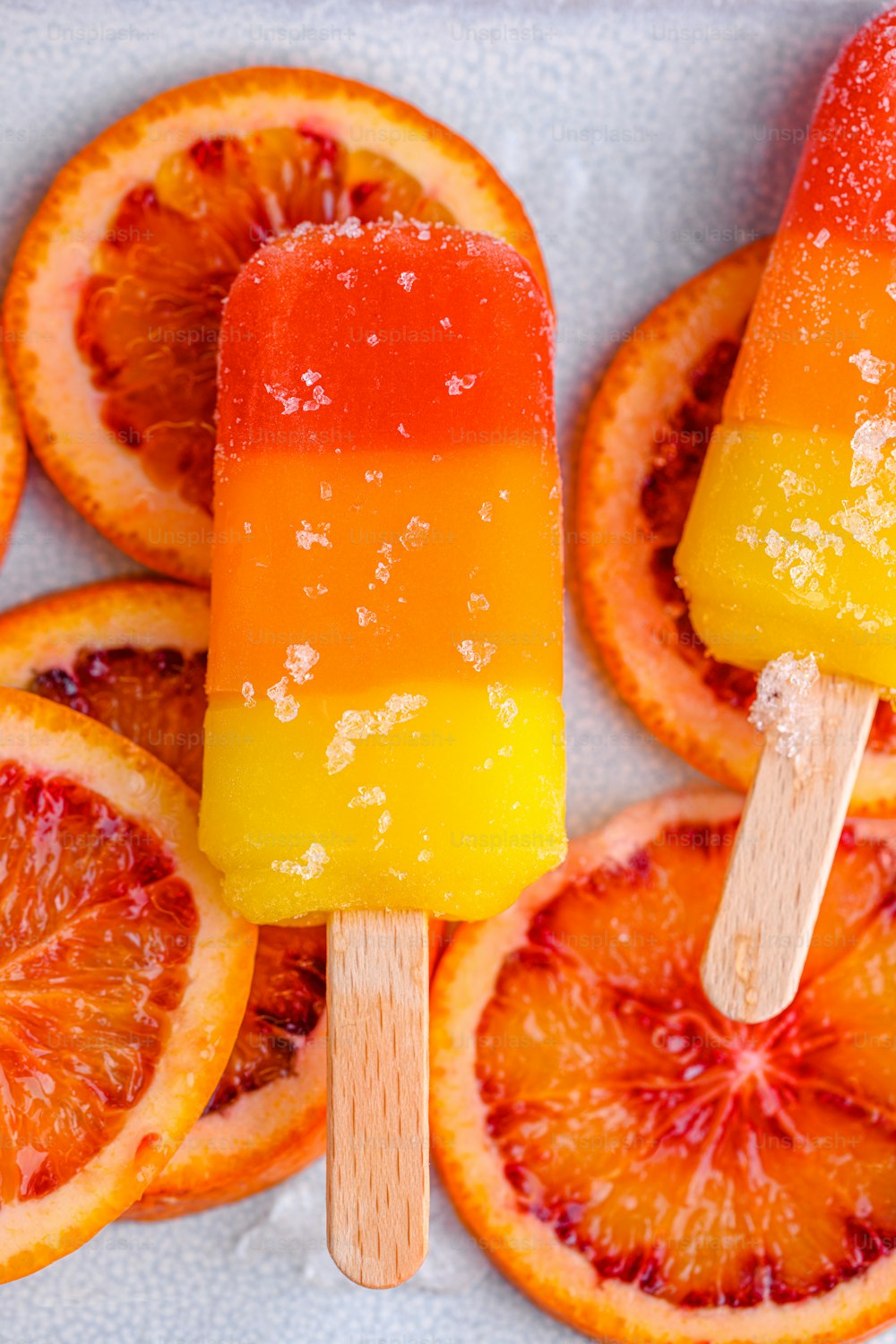 a close up of a popsicle with orange slices