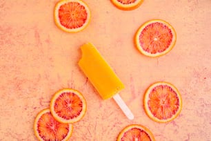 a popsicle with orange slices cut in half