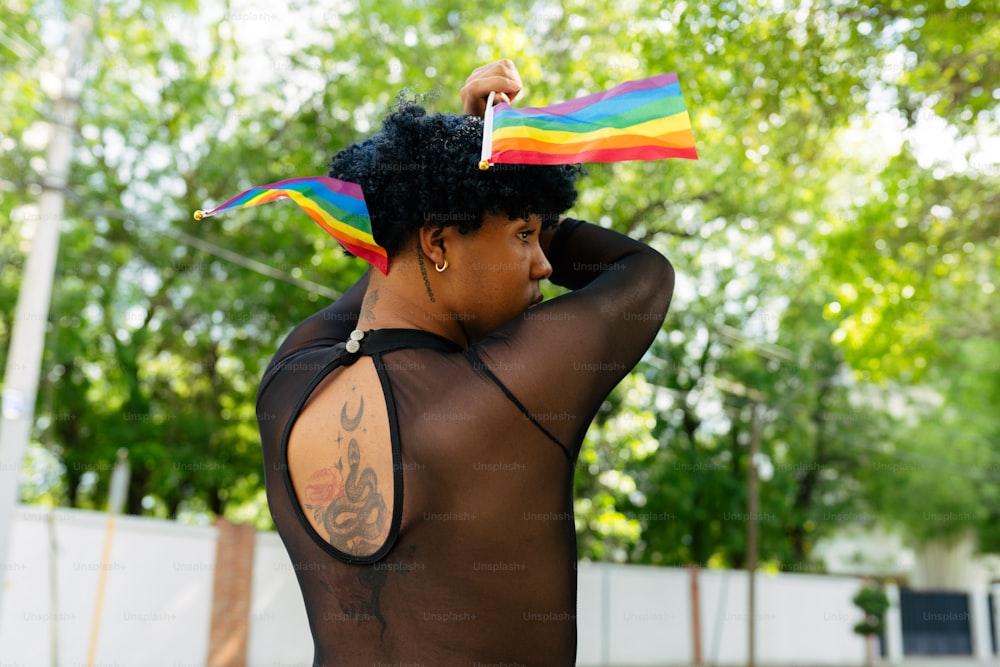 a woman with a rainbow flag on her head