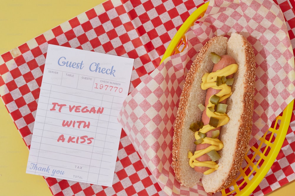 a close up of a hot dog in a basket