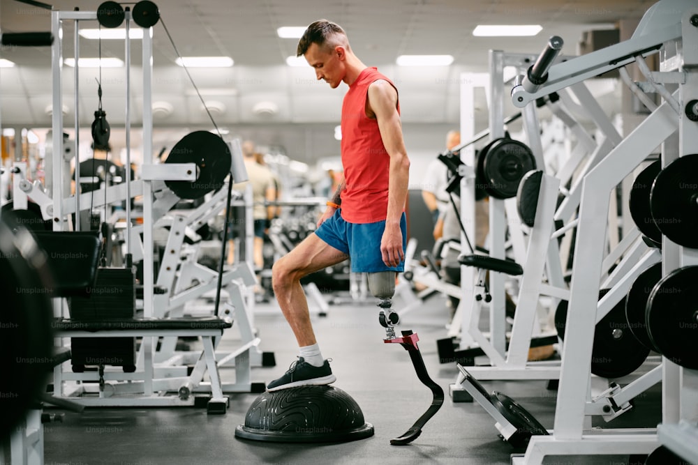 a man with a prosthetic leg in a gym