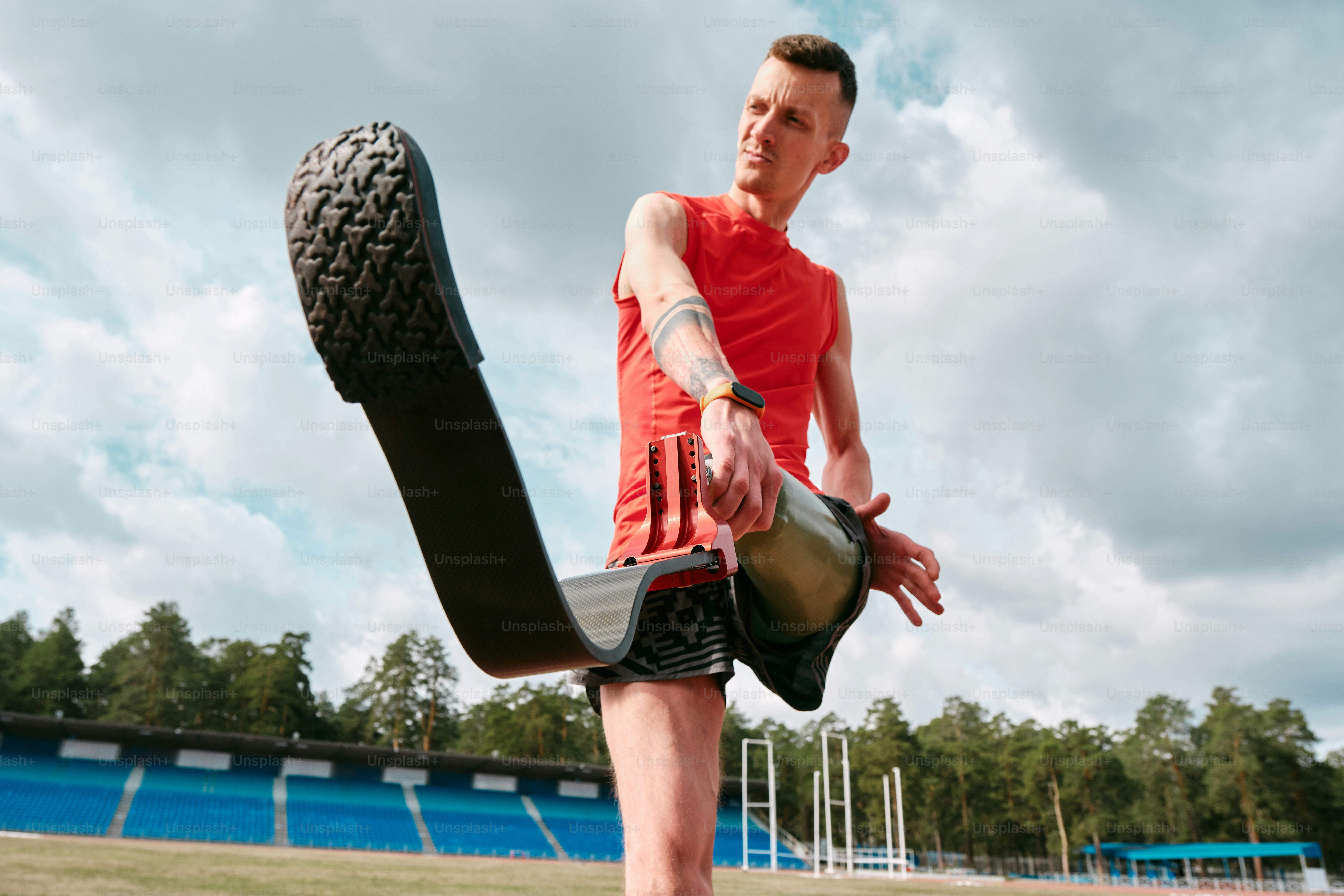 Athlete relaxing during compression recovery boots usage after training session