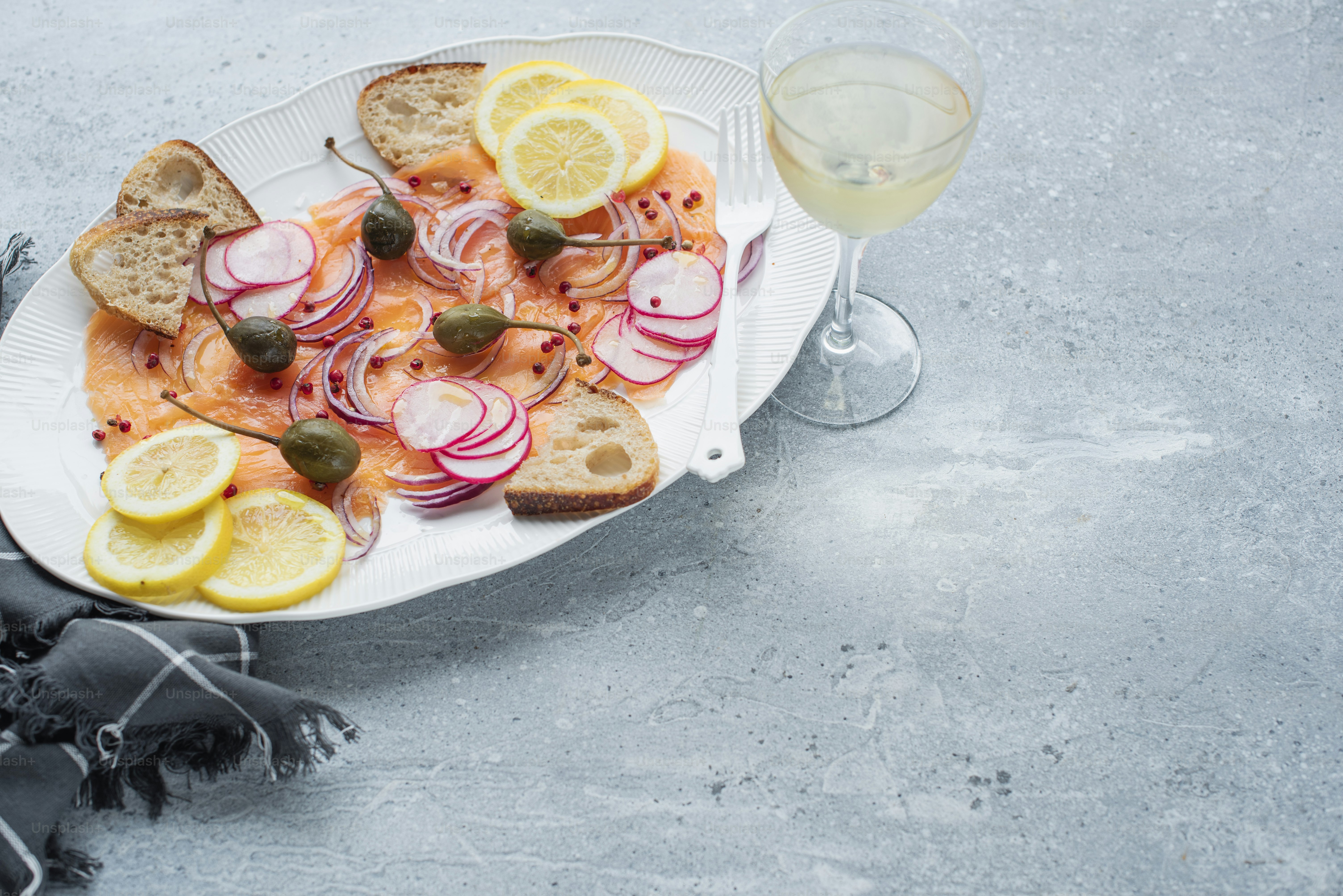 a plate of food and a glass of wine