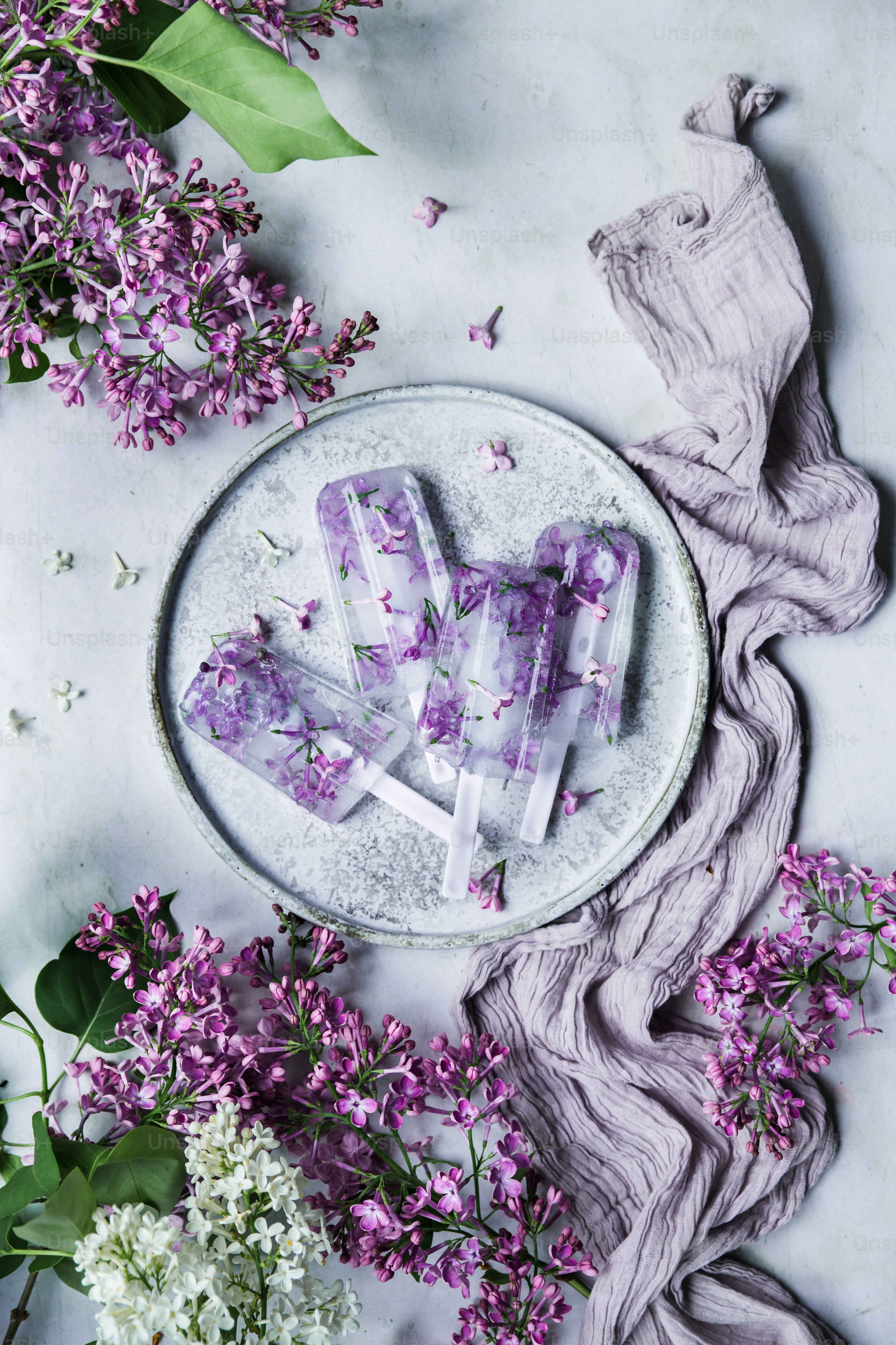 a plate with purple flowers and letters on it
