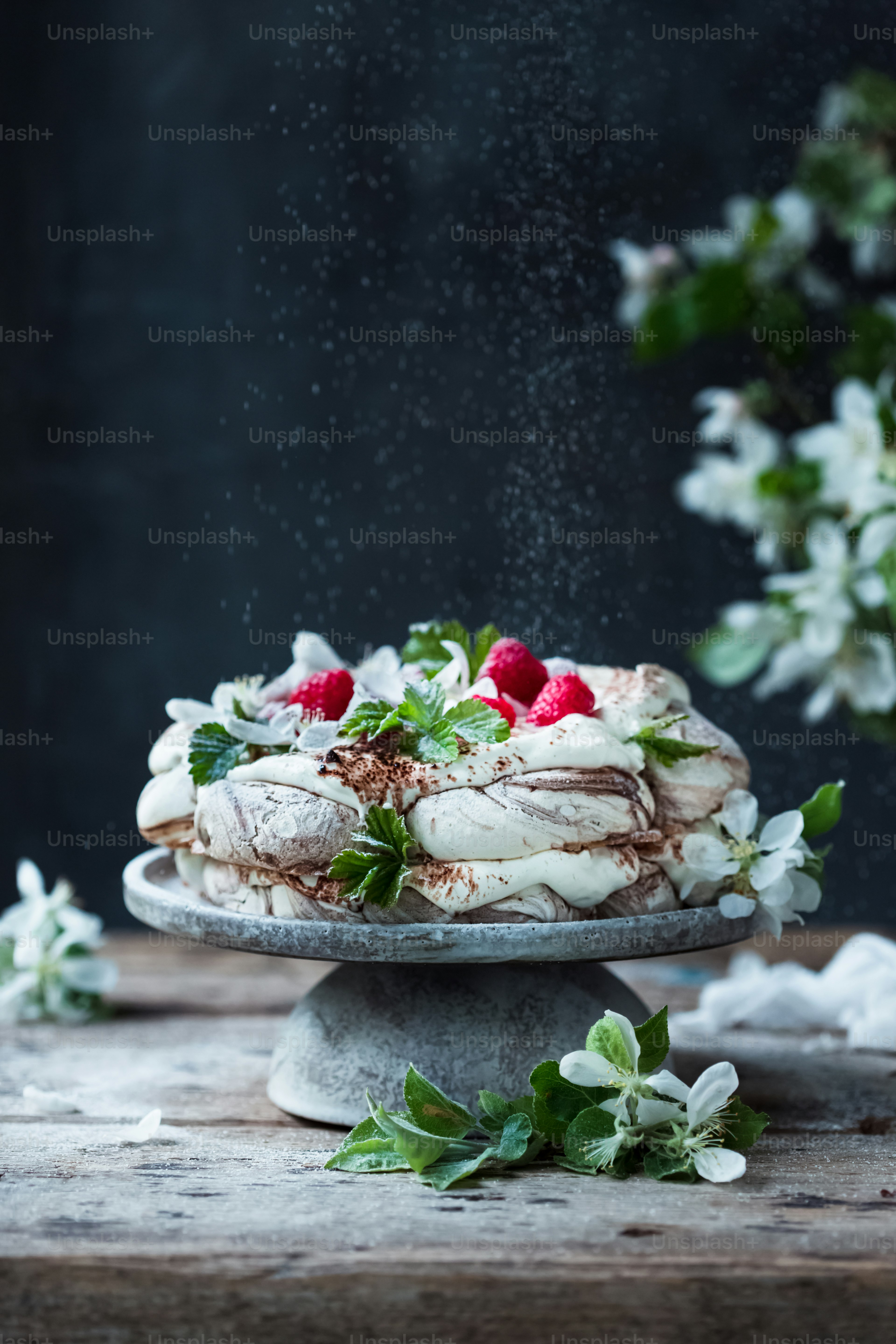 a cake with strawberries and whipped cream on top