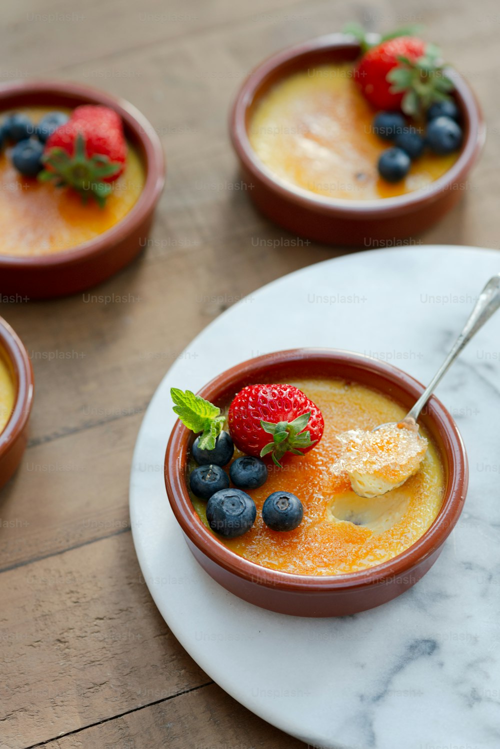 a bowl of fruit is sitting on a table