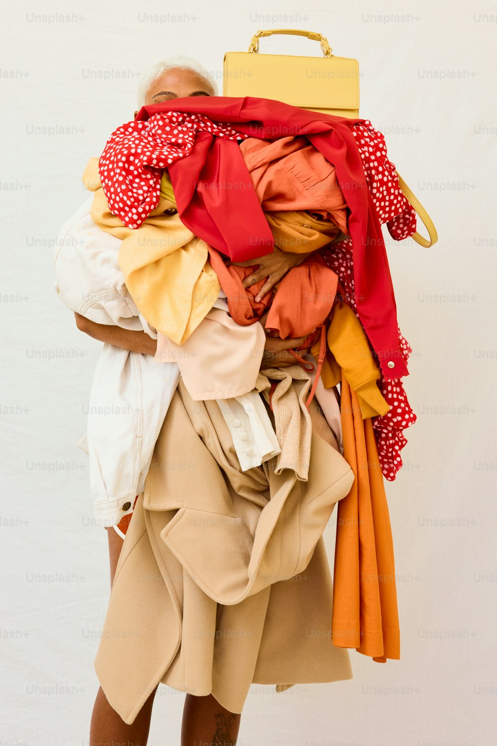 a woman carrying a suitcase full of clothes