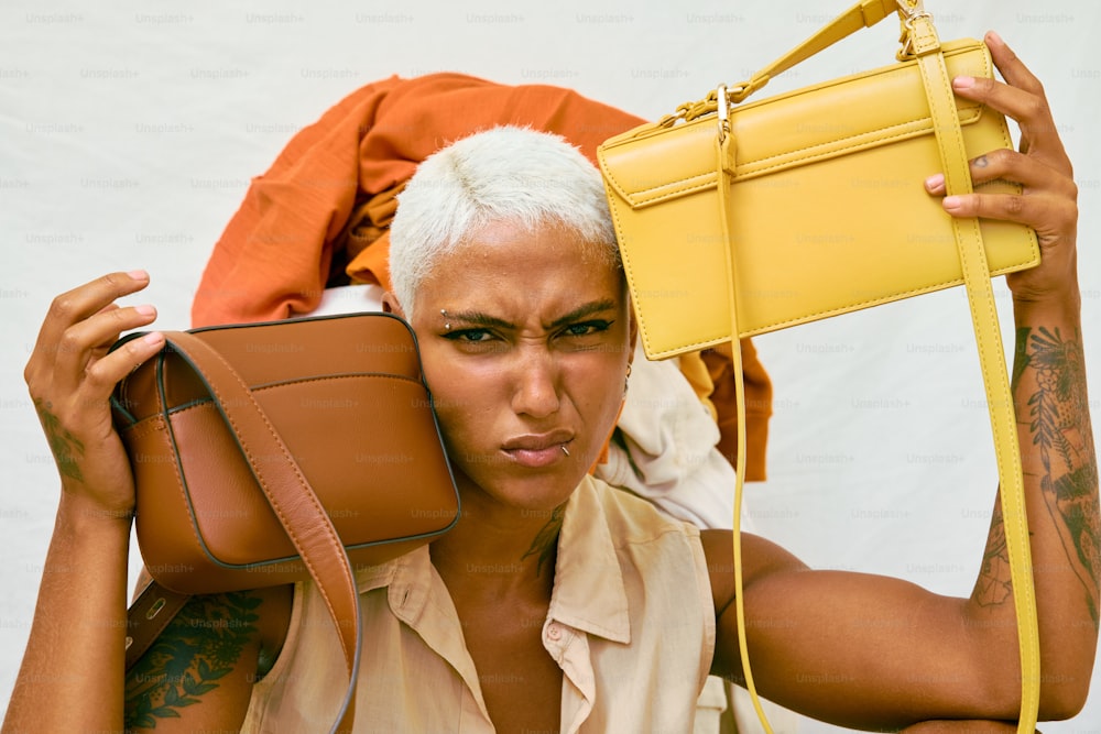 a woman holding a yellow purse over her head