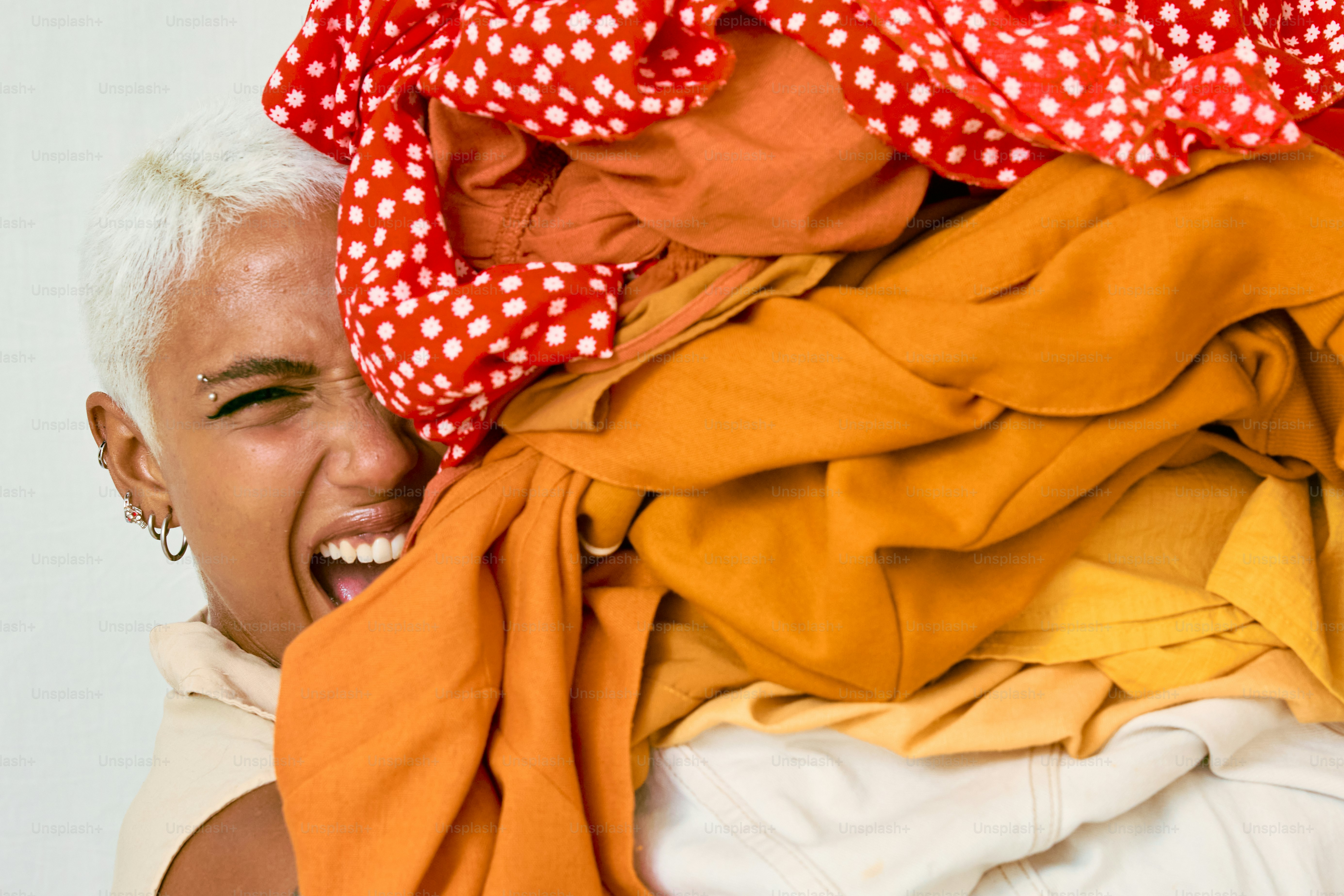 a woman with white hair and a red polka dot scarf covering her head