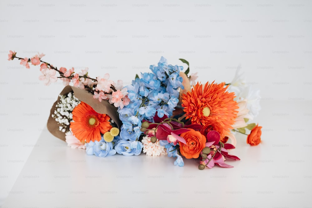 a bunch of flowers that are sitting on a table