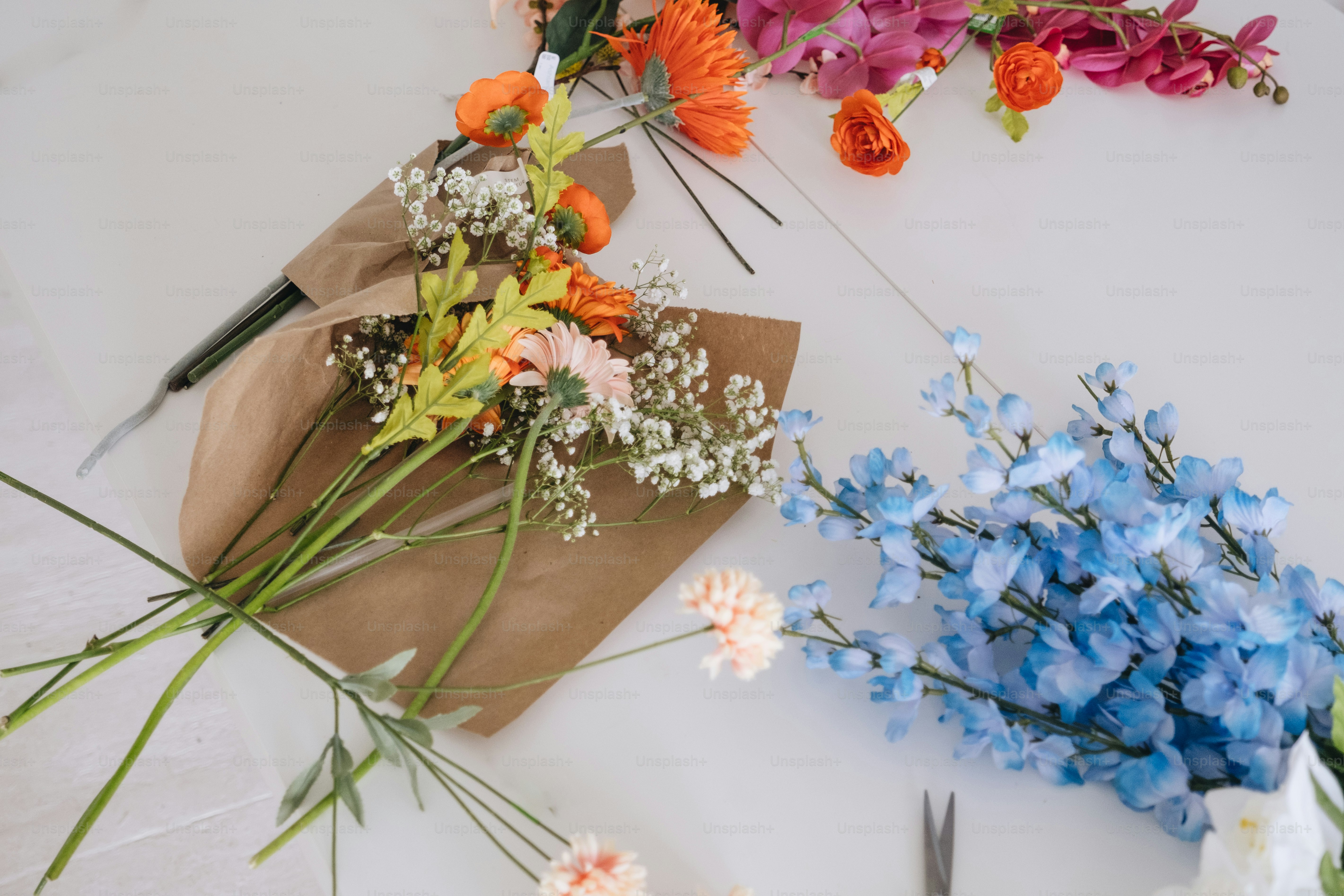 a bunch of flowers sitting on top of a table