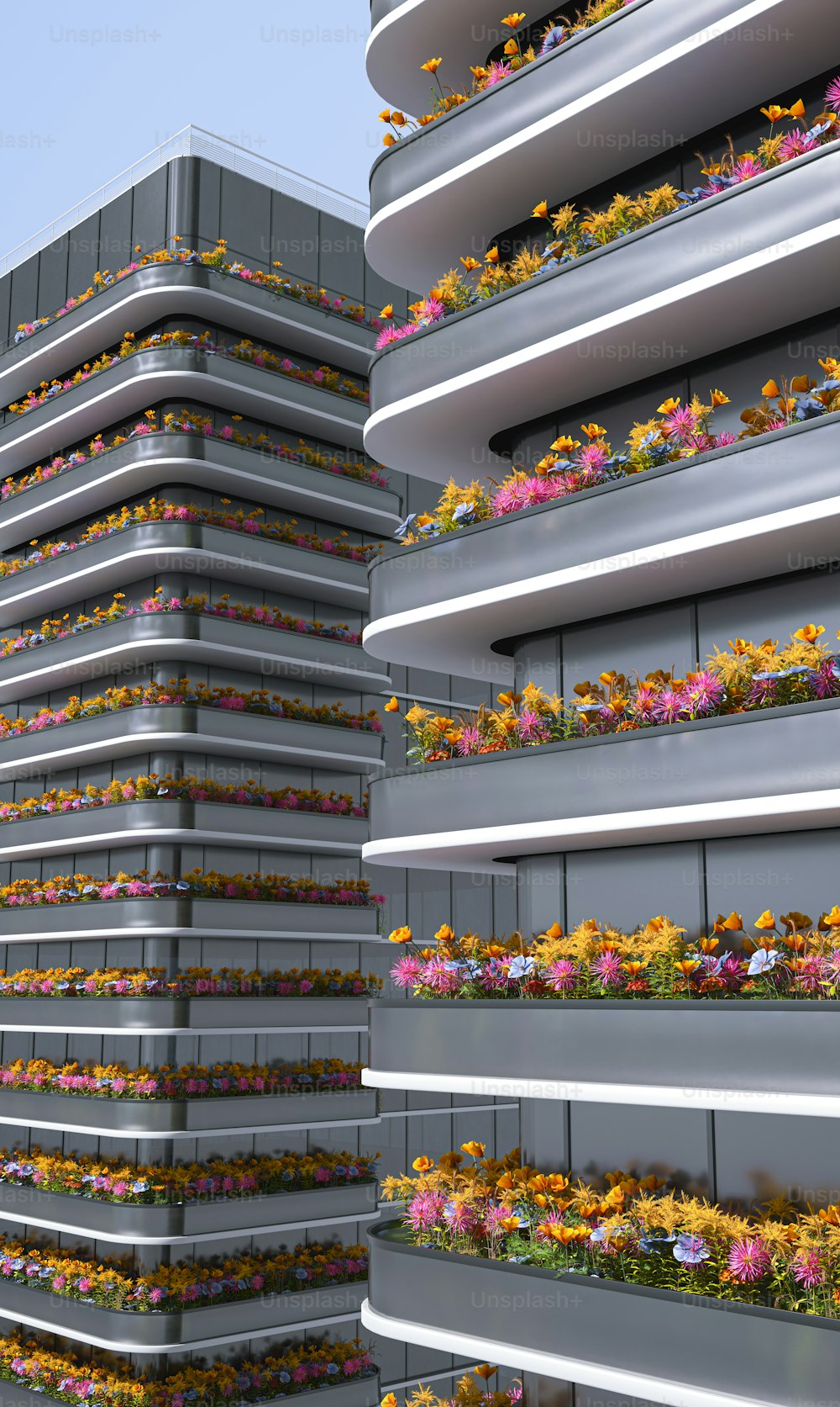 a tall building with a bunch of flowers growing on it