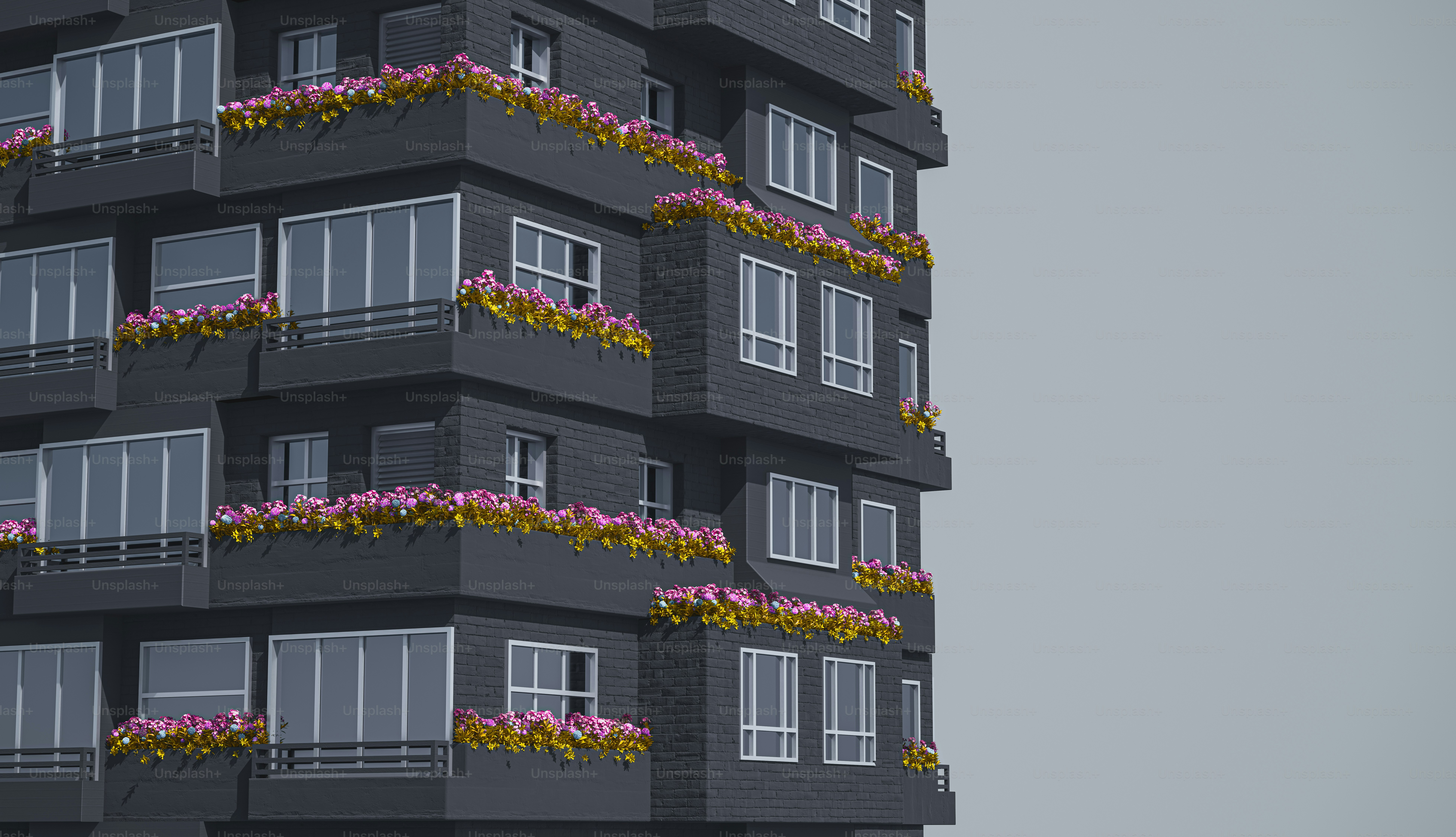 a tall building with flowers on the balconies