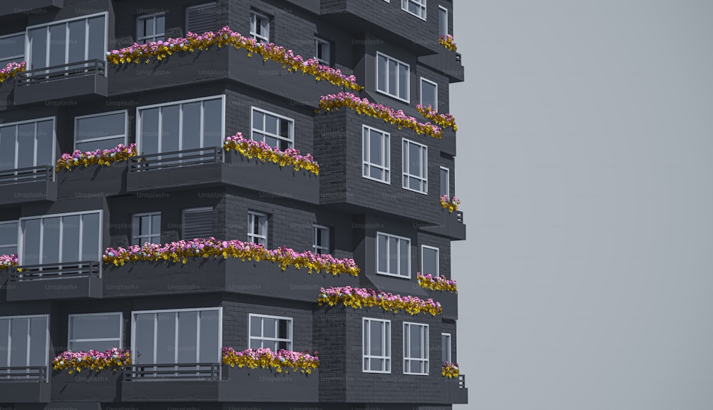 a tall building with flowers on the balconies