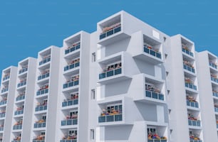 ein hohes weißes Gebäude mit Balkonen und Balkonen auf dem Balkon