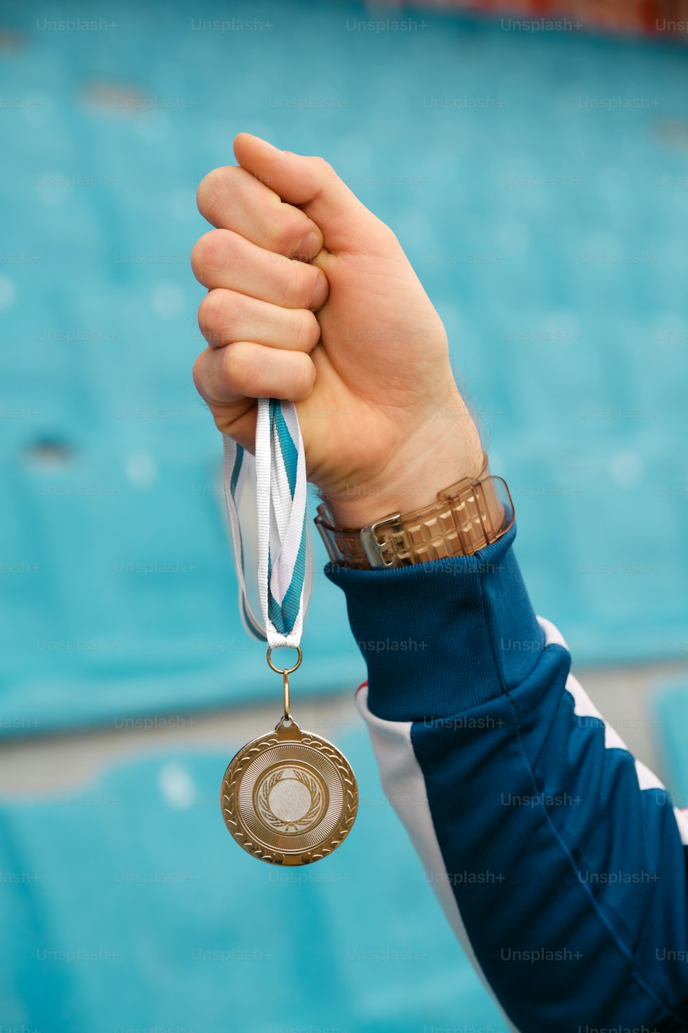 a person holding a medal in their hand