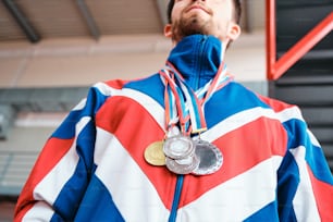 a man with a medal and a medal around his neck
