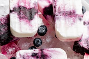 a bowl of ice cream with blueberries and blueberries on top