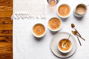 a table topped with three cups of coffee