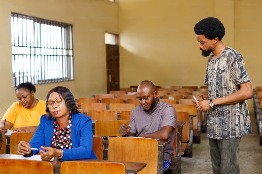 a man standing next to a woman in a classroom
