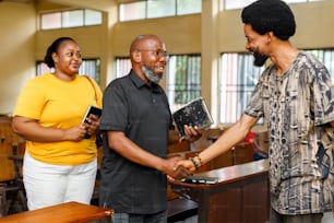 a man shaking hands with a woman in a courtroom