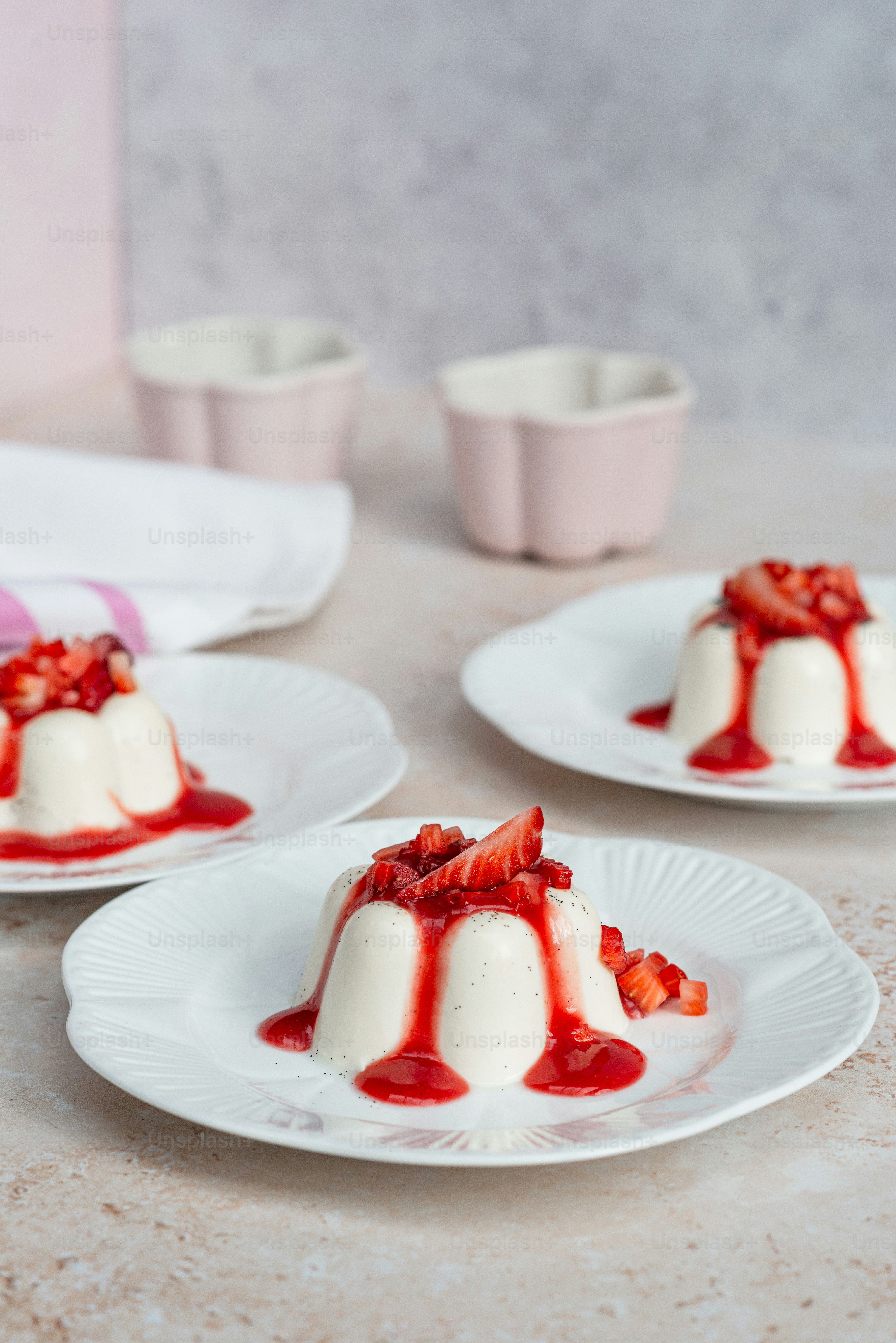 three plates with desserts on them on a table