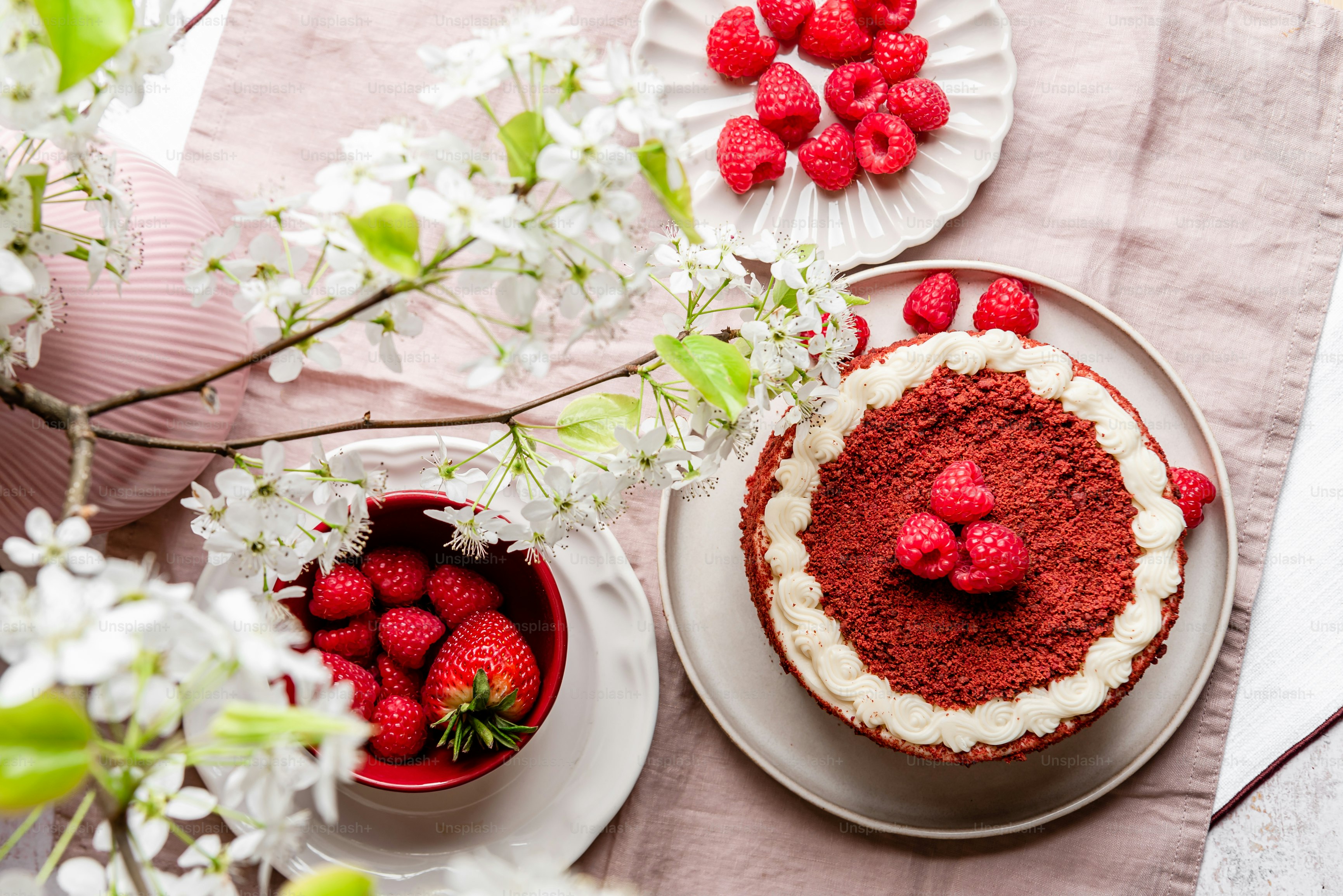 a cake on a plate with strawberries on it