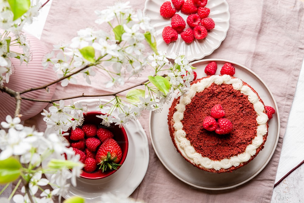 a cake on a plate with strawberries on it