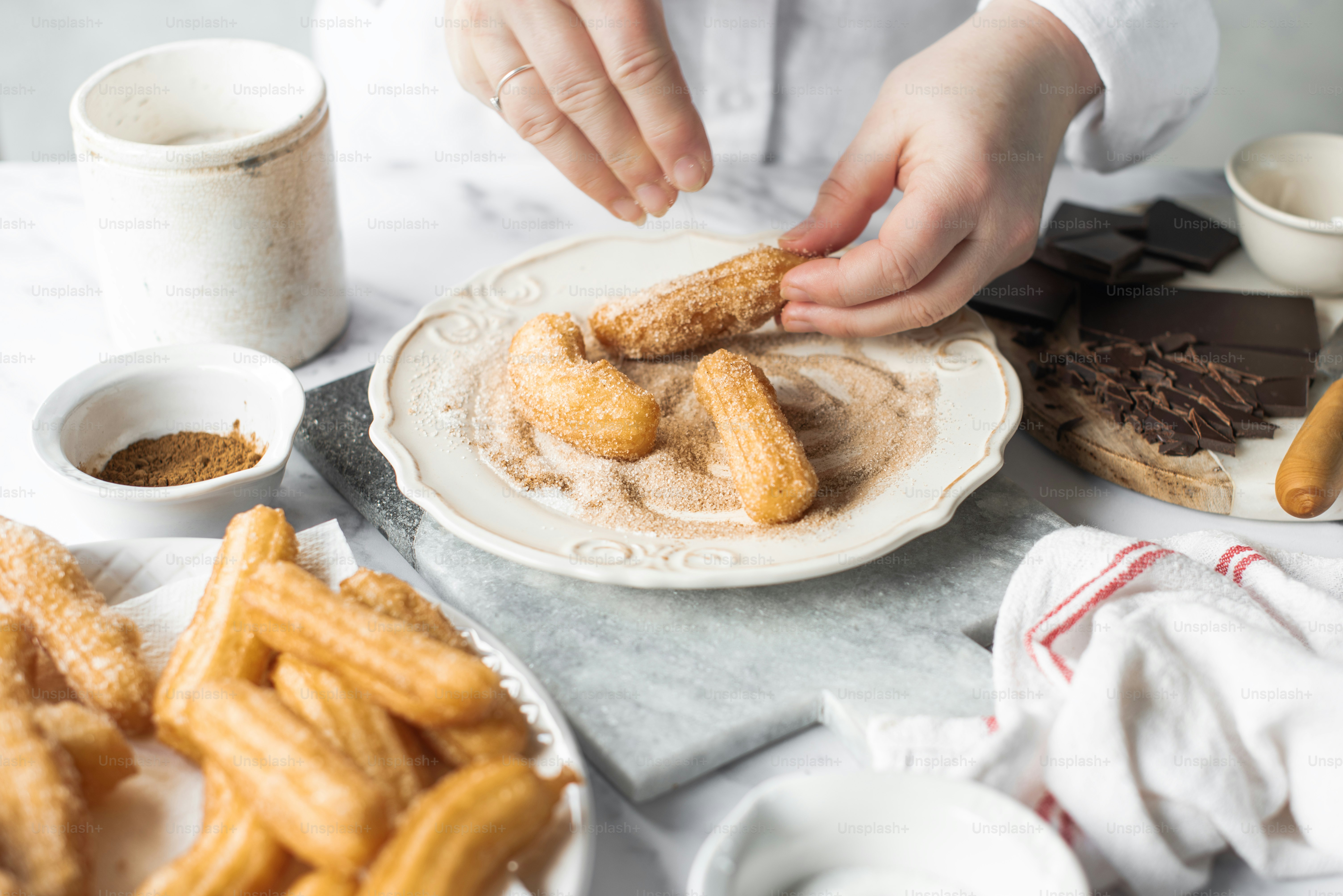 a person is dipping some kind of food on a plate