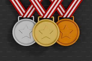 Drei Gold-, Silber- und Bronzemedaillen auf schwarzem Hintergrund
