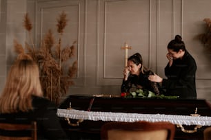 a couple of women sitting at a table