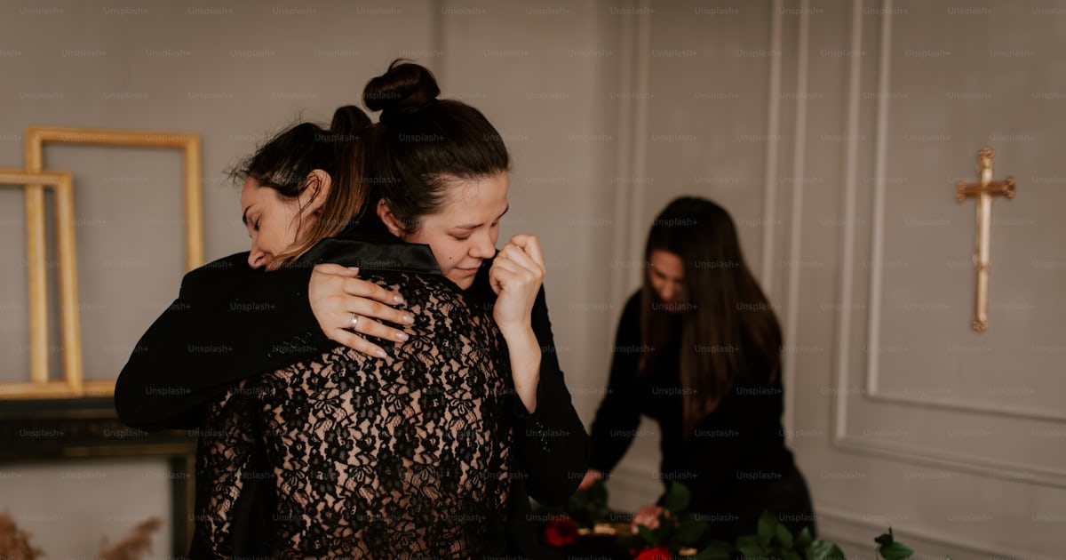 Two women hugging each other in a room photo – Death Image on Unsplash