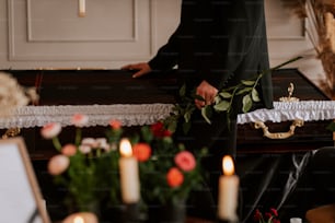 a man in a suit holding a bouquet of flowers