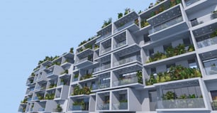 Un très grand bâtiment avec de nombreux balcons remplis de plantes