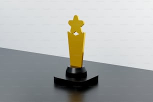 a yellow trophy sitting on top of a black table