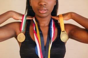 a woman with two medals around her neck