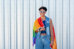 a woman with a rainbow scarf around her neck