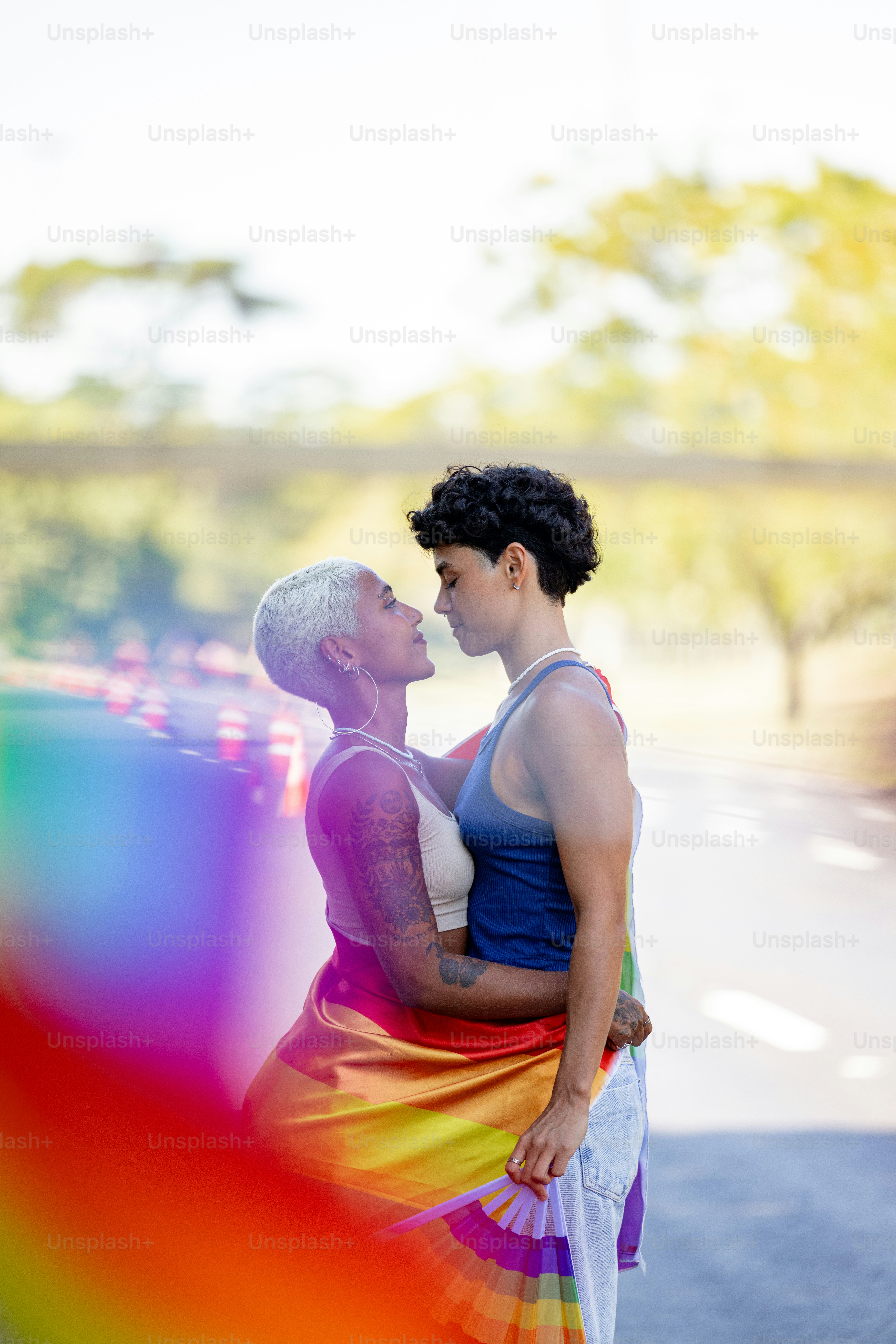 A man and a woman standing next to each other photo – Love Image on ...