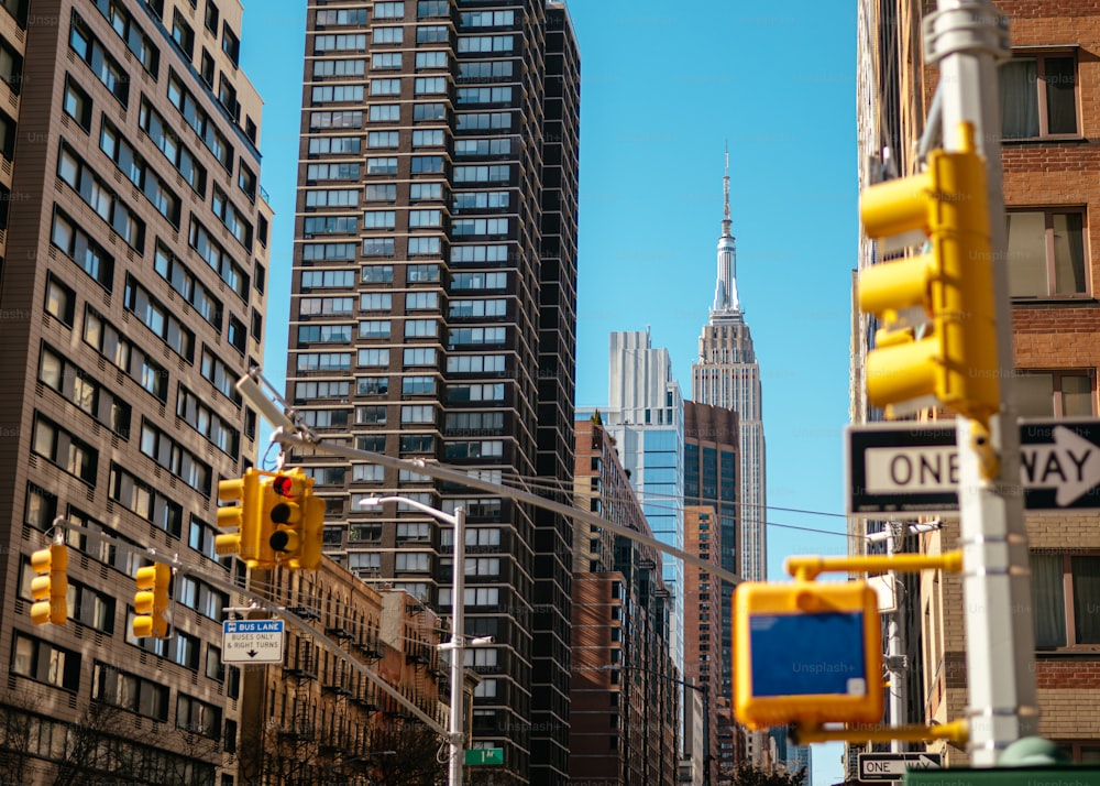 a city street filled with traffic and tall buildings