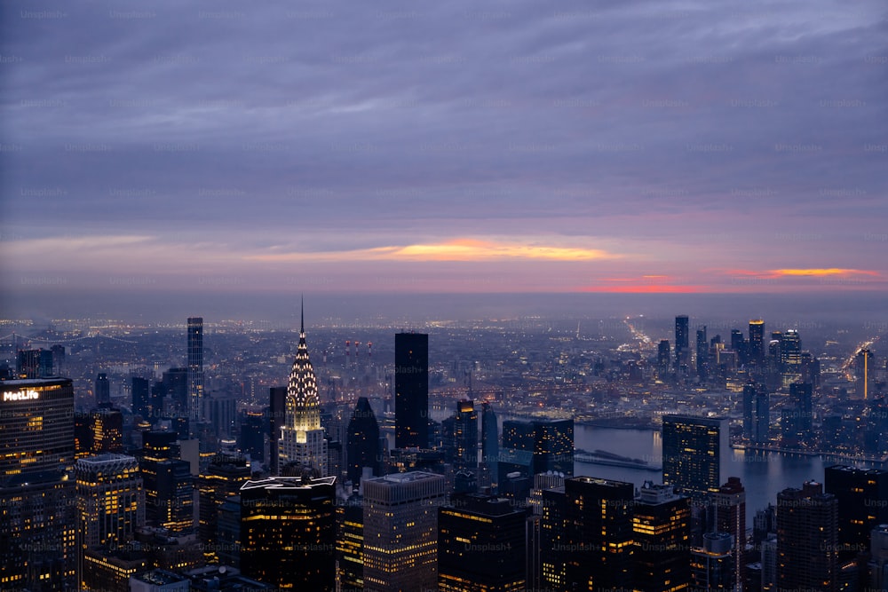 a view of a city at night from the top of a building