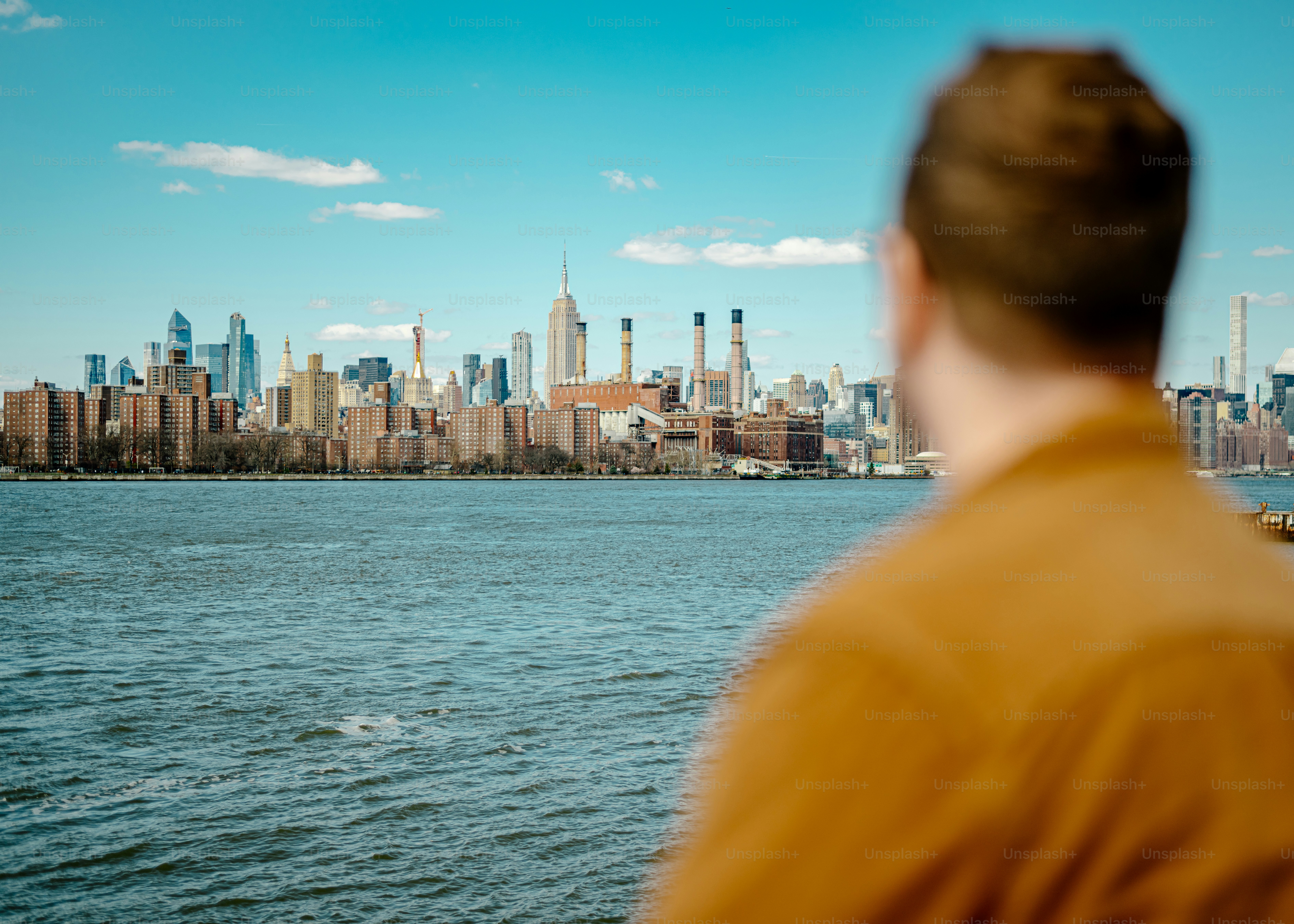 a man looking out over a large body of water