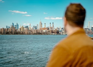 a man looking out over a large body of water