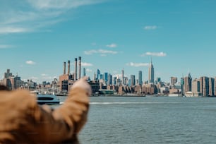 a man taking a picture of a city skyline